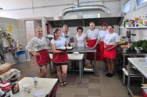 a group of people standing in a kitchen at Paleo Premium in Władysławowo
