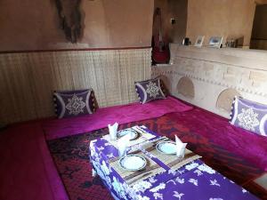 A bed or beds in a room at Dar Yaya