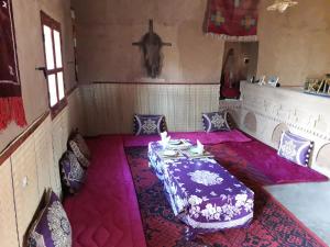 A bed or beds in a room at Dar Yaya