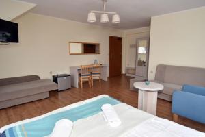 a living room with a bed and a couch at Paleo Premium in Władysławowo