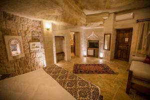 A bed or beds in a room at Zara Cave Hotel