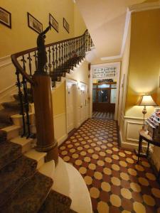 a stairway leading up to a room with a staircase at Minto House in Edinburgh