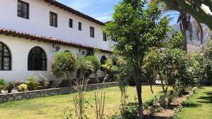 a house with a garden in front of it at Hotel de Turistas Abancay in Abancay
