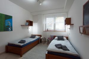 Una cama o camas en una habitación de Apartmán Tatran Donovaly Deluxe
