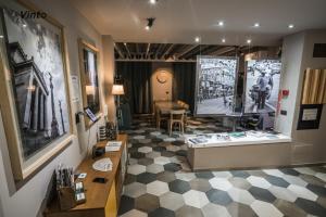 a store with a checkered floor and a large window at Vinto House Salerno Downtown in Salerno +37 photos