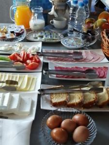 a table topped with lots of different types of food at Family Hotel Yagoda88 - Free Parking in Sofia