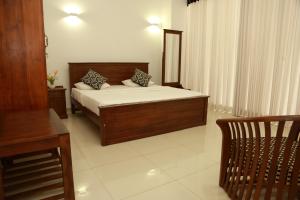 Кровать или кровати в номере Single Fin Weligama