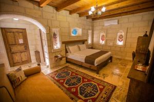 A bed or beds in a room at Zara Cave Hotel