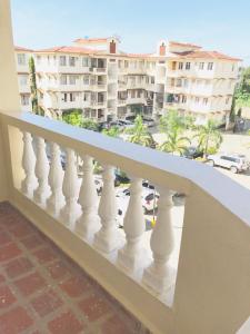 a balcony with a view of a city at Bandari apartment in Mombasa