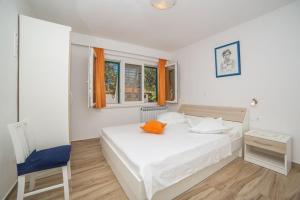 Posteľ alebo postele v izbe v ubytovaní Apartmani Stipan
