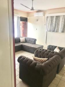 a living room with a couches and a couch at Bandari apartment in Mombasa