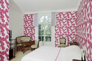 Ein Bett oder Betten in einem Zimmer der Unterkunft Hotel Les Goelands