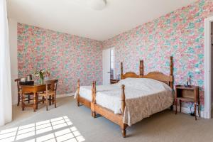 Ein Bett oder Betten in einem Zimmer der Unterkunft Hotel Les Goelands