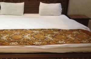 Cama o camas de una habitación en Jawhra Ghurnata Apartment
