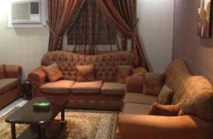 Zona de estar de Jawhra Ghurnata Apartment