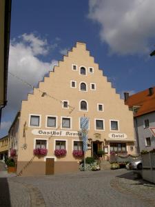 a large building with a pyramid shape on it at Hotel-Gasthof Krone in Greding