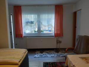 a room with a large window with red curtains at Singerstr 14 in Nuremberg