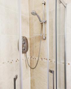 a shower with a shower head in a bathroom at New 1 Bed First Floor Flat in Central Fareham in Fareham