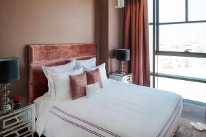 מיטה או מיטות בחדר ב-Dream Inn Apartments - City Walk Prime
