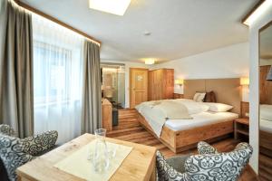 Postel nebo postele na pokoji v ubytování Hotel Maria Theresia