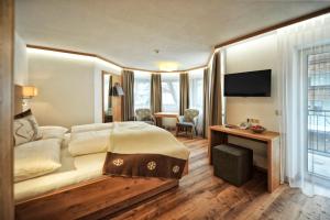 Postel nebo postele na pokoji v ubytování Hotel Maria Theresia