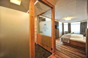 Postel nebo postele na pokoji v ubytování Hotel Maria Theresia