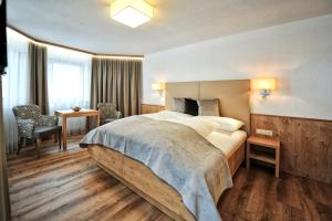 Postel nebo postele na pokoji v ubytování Hotel Maria Theresia