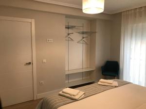 A bed or beds in a room at Apartamento Abuelo Mayorga