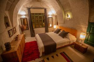 Postel nebo postele na pokoji v ubytování Asmalı Cave House
