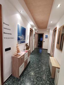 a hallway of an office building with a reception desk at Fiocco di Neve in Tarvisio