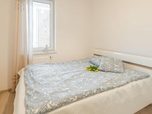 Posteľ alebo postele v izbe v ubytovaní Feniks Apartament