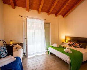 Postel nebo postele na pokoji v ubytování Residence Duna Rossa - Family Friendly