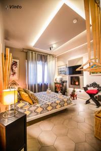 a bedroom with a large bed in a room at Vinto House Salerno Downtown in Salerno