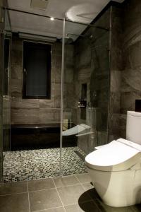 Koupelna v ubytování He-Jia Hotel