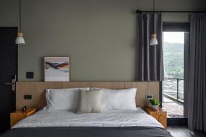 Ένα ή περισσότερα κρεβάτια σε δωμάτιο στο Two Easy Inn