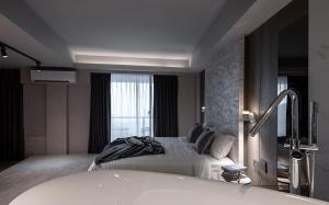 Ένα ή περισσότερα κρεβάτια σε δωμάτιο στο Two Easy Inn
