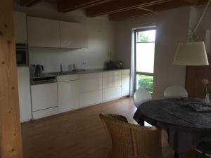 a kitchen with a table and a dining room at Ferienwohnung Trede in Kurort Gohrisch