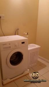 a washing machine in a bathroom with at Fitzy Haven in Gros Islet