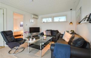a living room with a couch and a table at Lovely Home In Slagelse With Wifi in Slagelse