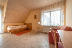 a small room with a bed and a window at Fewo im Naturpark in Spiegelberg