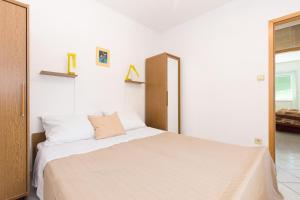 Posteľ alebo postele v izbe v ubytovaní Apartments Krajina
