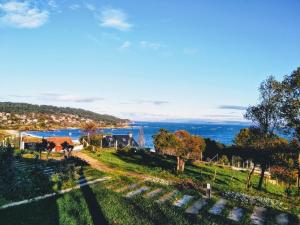 a view of the ocean from a hill at Casa Nueva Playa Areabrava Hio in Hio