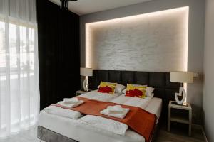 Postel nebo postele na pokoji v ubytování Apartamenty i Pokoje InforesPark