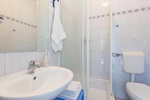 Kúpeľňa v ubytovaní Apartments Krajina