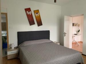 Postel nebo postele na pokoji v ubytování Apartmani Spomenka