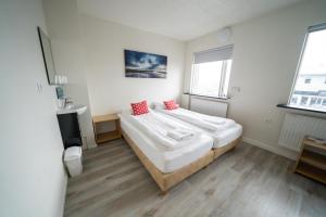 En eller flere senge i et værelse på North Star Guesthouse Olafsvik