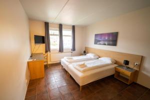 Ліжко або ліжка в номері North Star Hotel Olafsvik