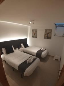 アガエテにあるCASA VISTAS TAMADABAのベッドが2つある部屋にベッドが2つあります sidx sidx sidx sidx