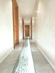 a hallway with a water feature in the floor at Casa Orrù in Nuoro