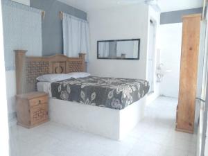 Postel nebo postele na pokoji v ubytování Hotel Juarez